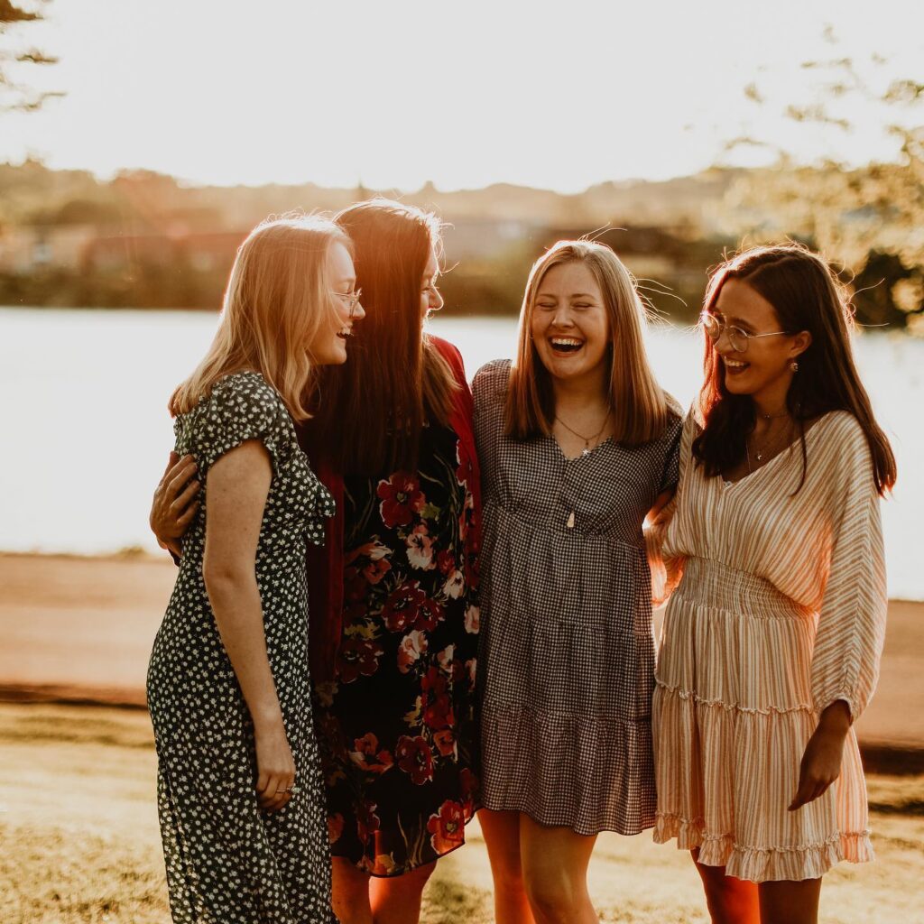 Single mother with young adults laughingchildren